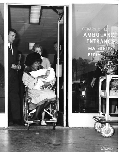 Eartha Kitt leaving hospital after giving birth to her daughter Kitt